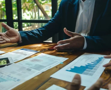 business-leader-businessman-leading-highstakes-negotiation-potential-partner-financial-document